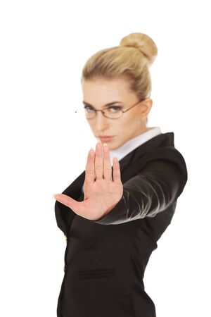 Young woman showing stop signの写真素材