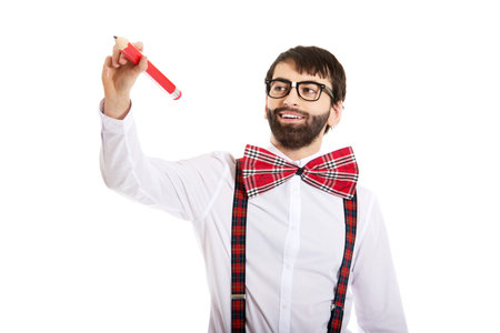 Man wearing suspenders writing with big pencil on space.