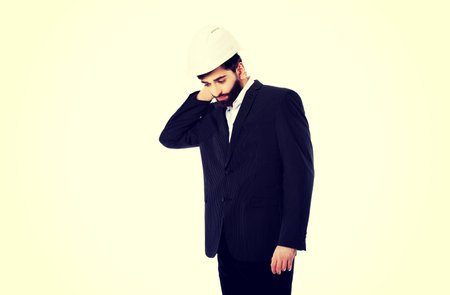 Businessman engineer suffering from neck pain.の写真素材