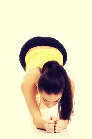 Young fitness woman in warm up exercise.の写真素材