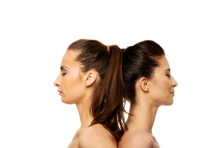 Two attractive topless sisters with make up.の写真素材