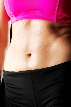 Athletic young woman on the gym.の写真素材