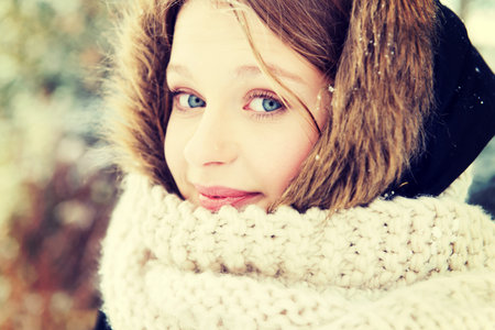 Teenage woman in winter clothes outdoor