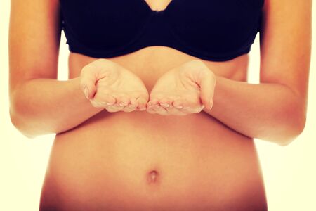 Caucasian woman in bikini with open hands.の写真素材