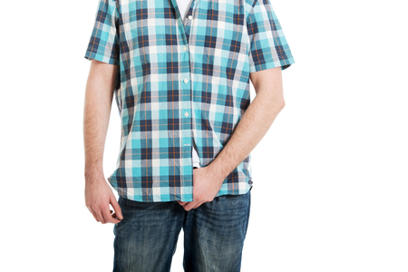 Young man holding his crotch because of pain.の写真素材