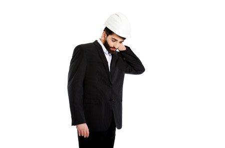 Businessman engineer suffering from neck pain.
