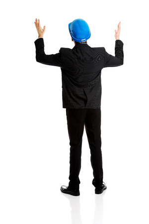 Happy engineer businessman showing empty copyspace on hands.の写真素材