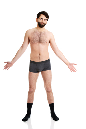 Young handsome shirtless man with arms wide open.の写真素材