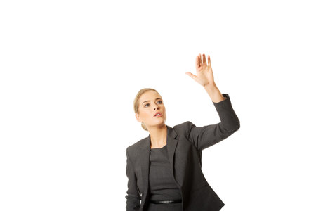 Businesswoman pressing an abstract button.の写真素材