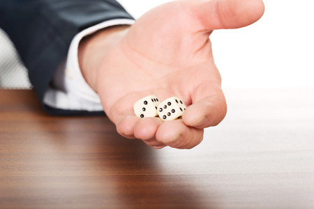 Businessman's hand with two dices.の写真素材