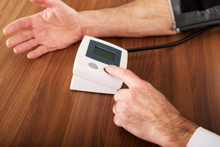 Closeup on businessman measuring blood pressure.の写真素材