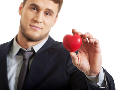 Handsome businessman with heart model.の写真素材