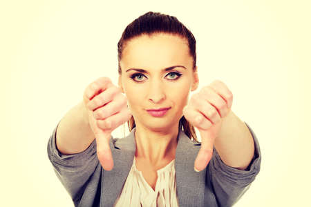 Modern business woman showing thumbs down.の写真素材