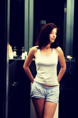 Natural beautiful smiling woman in bathroom.の写真素材