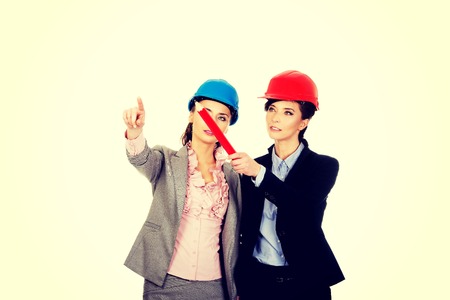 Two attractive architects women talking.の写真素材