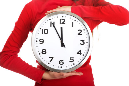 Young student woman with the clock.