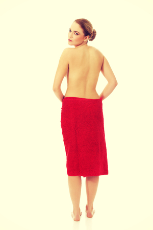 Beautiful topless woman wrapped in towel.の写真素材