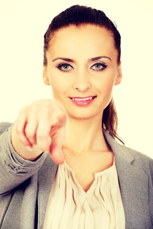 Beautiful confident businesswoman pointing on you.の写真素材