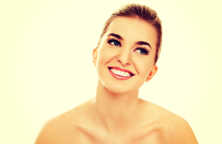 Smiled young naked woman, isolated on white.の写真素材