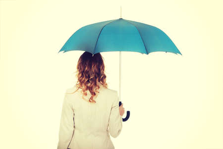 Attractive businesswoman holding an umbrella.の写真素材
