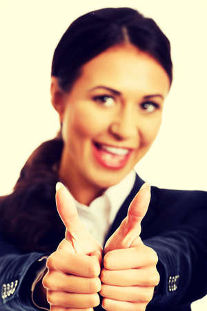 Businesswoman with thumbs up gesture.の写真素材