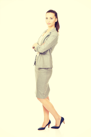 Beautiful confident businesswoman with folded arms.の写真素材