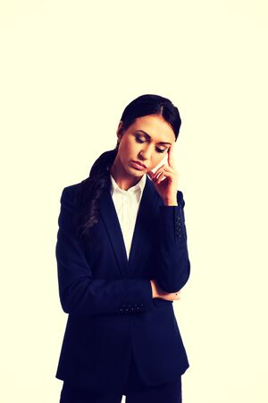 Worried businesswoman tired because of troubles.の写真素材