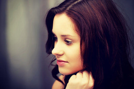 Beautiful woman wearing evening dress in bedroom.の写真素材
