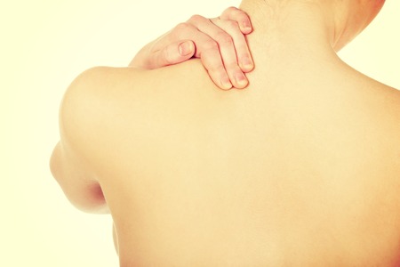 Caucasian woman holding her neck.の写真素材