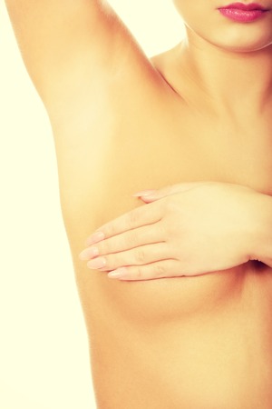 Woman examining breast mastopathy or cancer.の写真素材