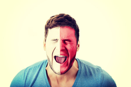 Screaming man with Malta flag painted on face.