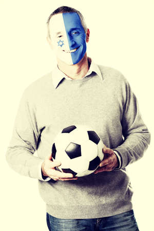 Mature man with Israel flag painted on face.の写真素材