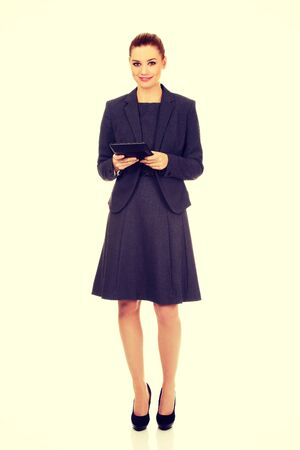 Beautiful business woman with tablet.の写真素材