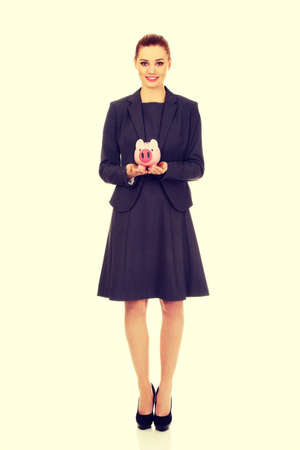 Happy business woman with piggybank.の写真素材