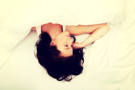 Beautiful woman sleeping in bed.の写真素材