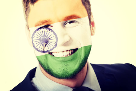Happy man with India flag painted on face.
