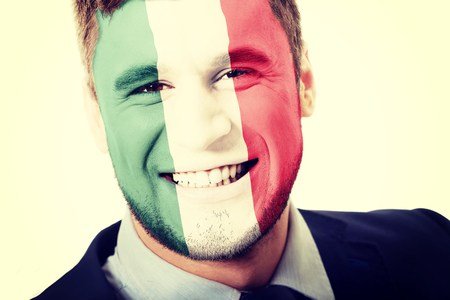 Happy man with Mexico flag painted on face.の写真素材