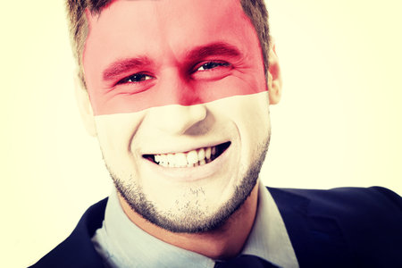Happy man with Monaco flag painted on face.の写真素材