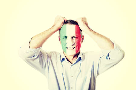 Mature man with Mexico flag painted on face.の写真素材