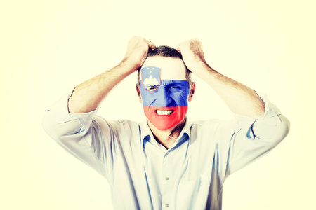 Mature man with Slovenia flag painted on face.の写真素材