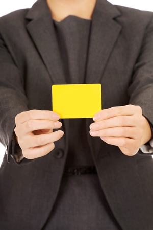 Woman's hands holding blank card.の写真素材