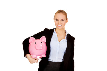 Young business woman holding  piggybank.の写真素材