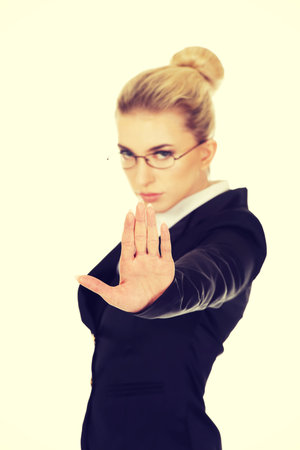 Young woman showing stop signの写真素材