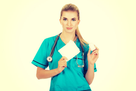 Female nurse holding gauze and hydrogen peroxide.