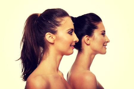 Two attractive sisters with make up.