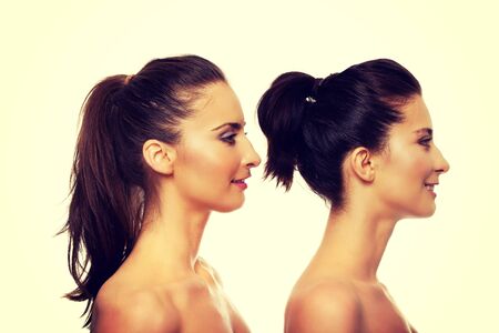 Beauty woman with make up standing behind her friend.の写真素材