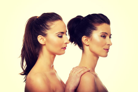 Beauty woman with make up standing behind her friend.