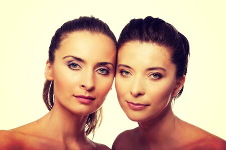 Two attractive sisters with make up.の写真素材