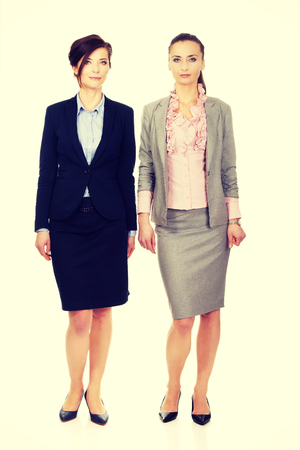 Beautiful two businesswomen wearing office outfits.の写真素材