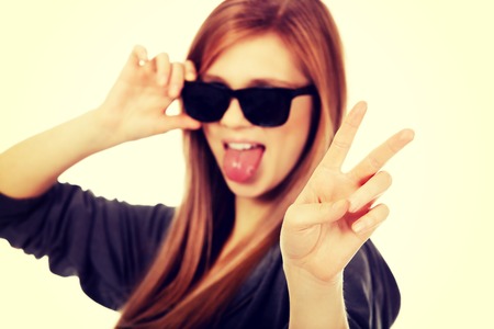 Young teenage woman wearing sunglasses.の写真素材